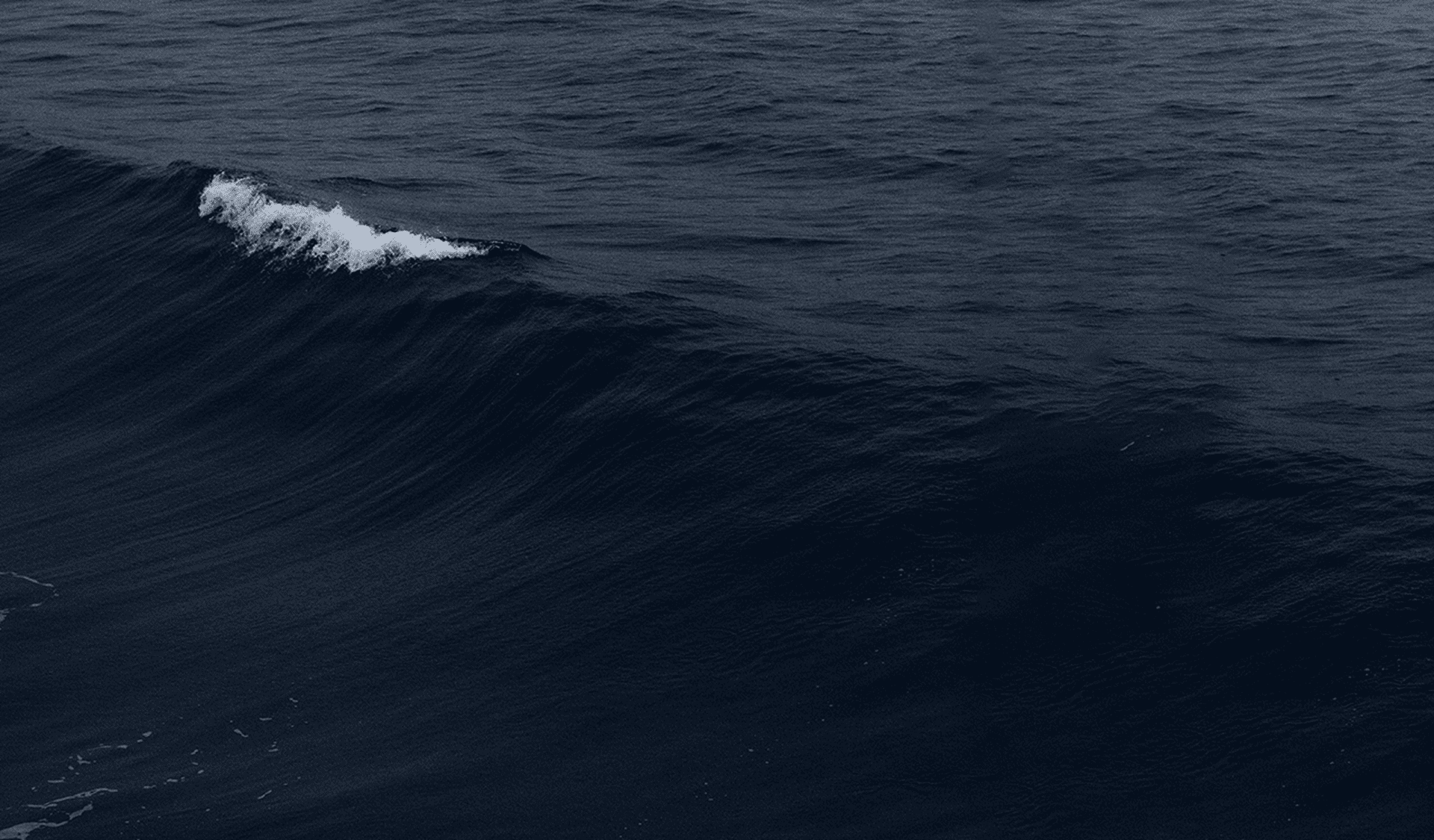 Image of a blue sea with a soft wave