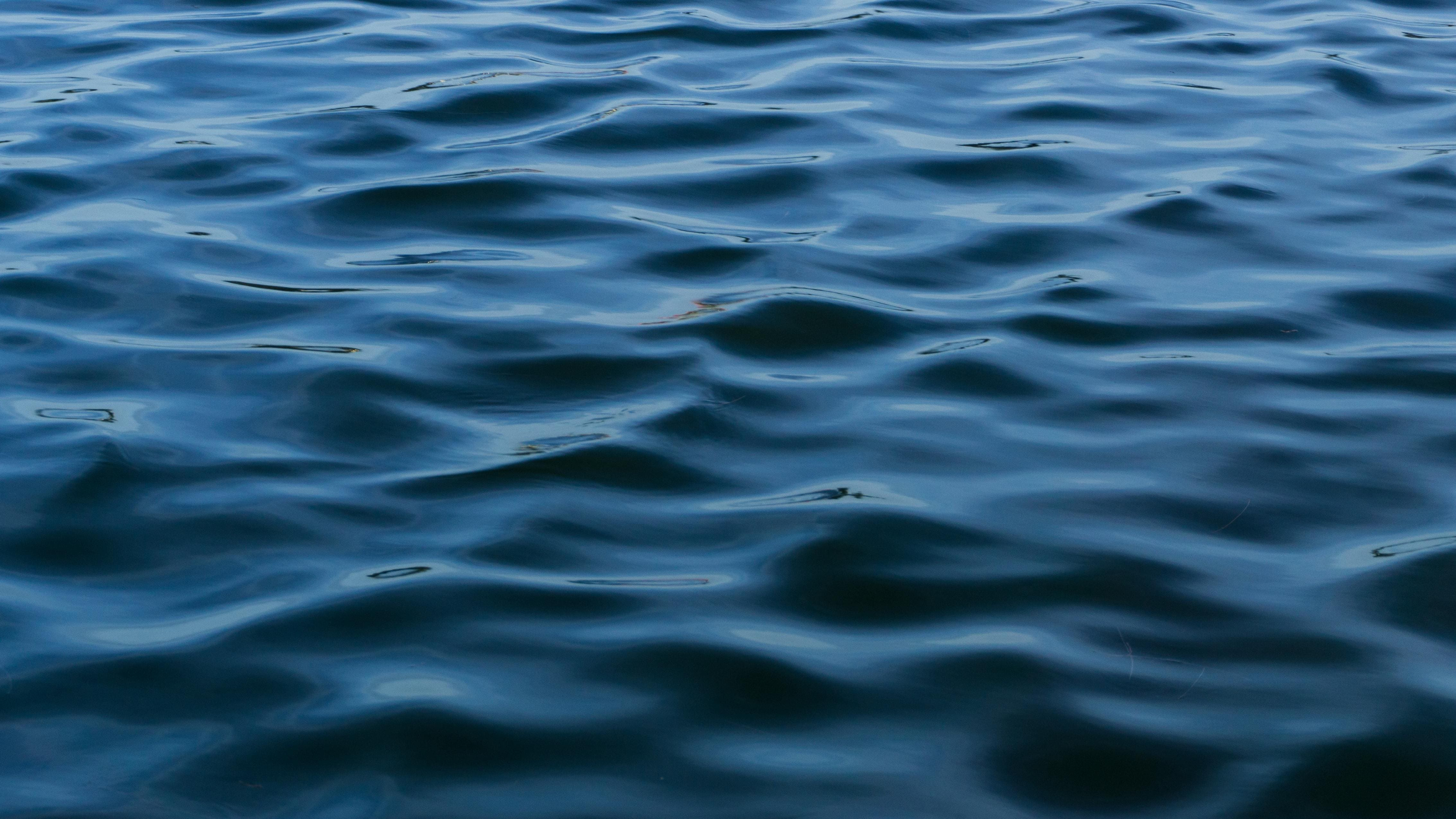 Close image of a blue sea with a calm tide